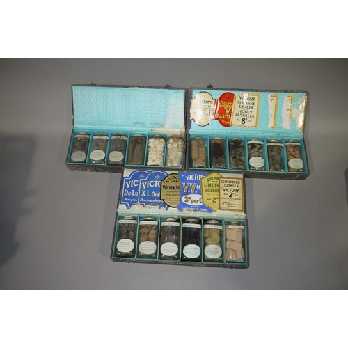 97 - Three early 20th century sample cases each containing six bottles of Victory lozenges, the interior ... 