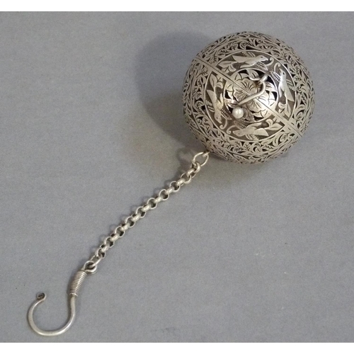 292 - A white metal gimbal incense burner carved with birds and leafage