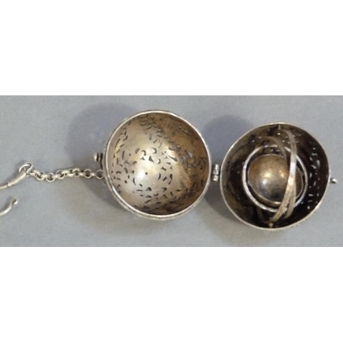 292 - A white metal gimbal incense burner carved with birds and leafage