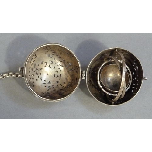 292 - A white metal gimbal incense burner carved with birds and leafage