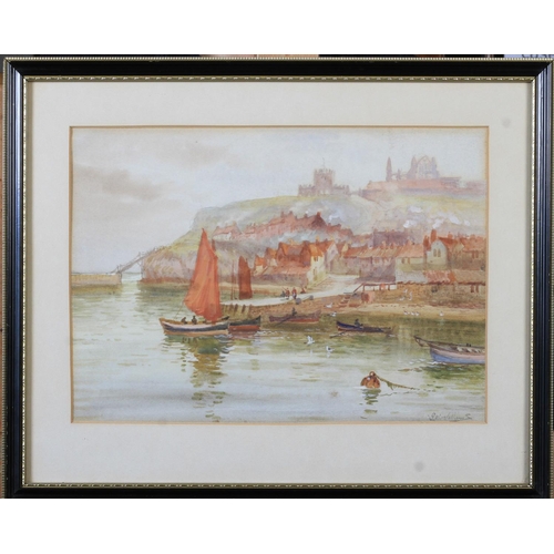 445 - J W WILLIAMS (fl.1900-1920) Whitby Harbour, cobbles heading out to sea, the town and abbey beyond, a... 