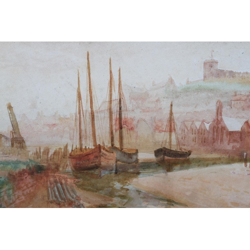 445 - J W WILLIAMS (fl.1900-1920) Whitby Harbour, cobbles heading out to sea, the town and abbey beyond, a... 