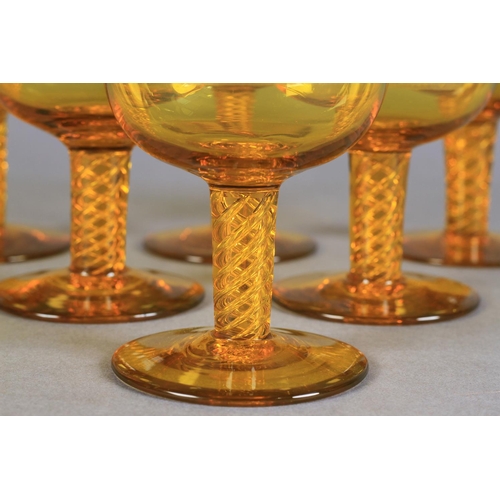 205 - A SET OF SIX AMBER GLASS SMALL WINES each bowl wheel engraved with a cockfighting scene, tapered air... 