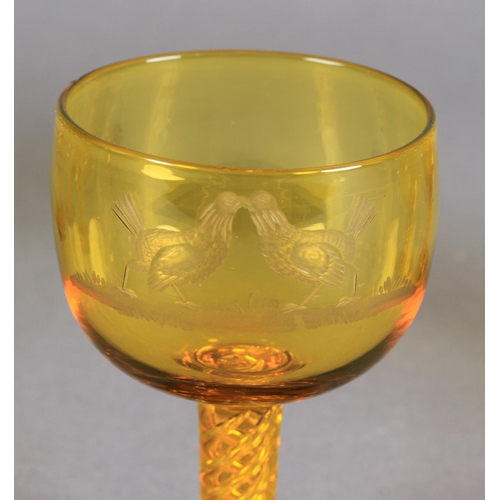 205 - A SET OF SIX AMBER GLASS SMALL WINES each bowl wheel engraved with a cockfighting scene, tapered air... 