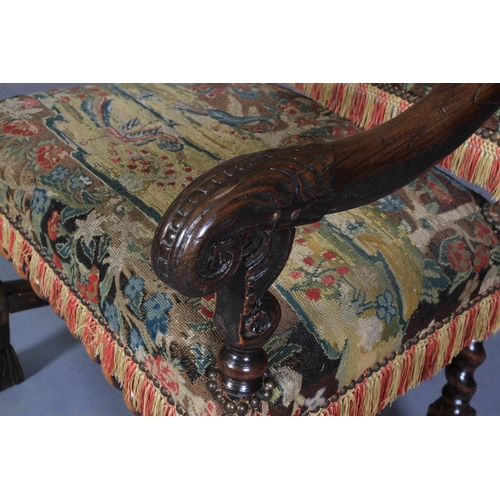 623 - A WALNUT OPEN ARMCHAIR, 17th century and later, the rectangular high back and seat upholstered in ne... 