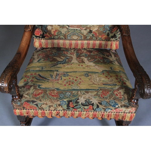 623 - A WALNUT OPEN ARMCHAIR, 17th century and later, the rectangular high back and seat upholstered in ne... 