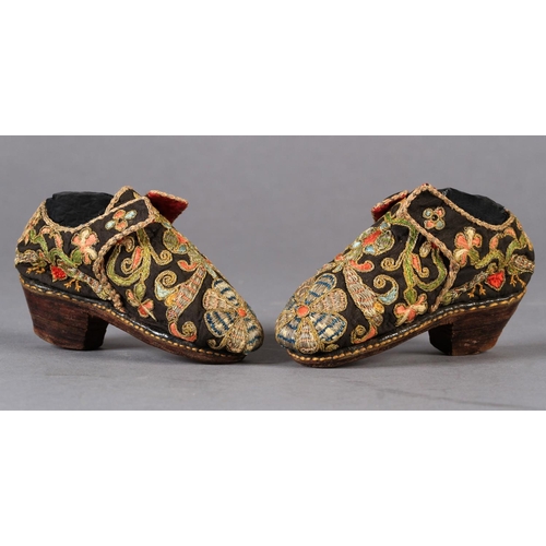 1 - A PAIR OF 17TH CENTURY CHILD'S SHOES embroidered in coloured silks and gilt metal thread with flower... 