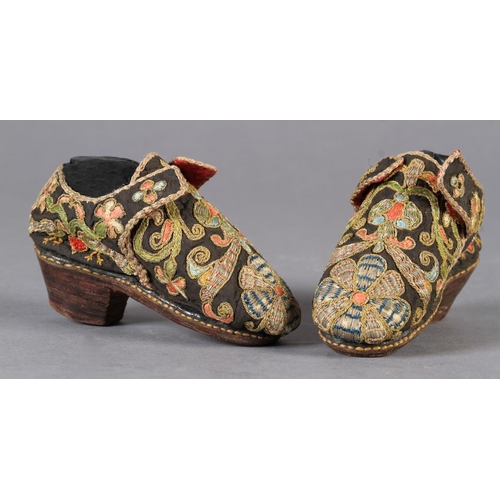 1 - A PAIR OF 17TH CENTURY CHILD'S SHOES embroidered in coloured silks and gilt metal thread with flower... 