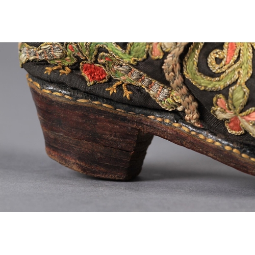 1 - A PAIR OF 17TH CENTURY CHILD'S SHOES embroidered in coloured silks and gilt metal thread with flower... 