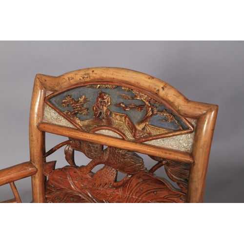 107 - A CHINESE ELM ELBOW CHAIR, the arched back with panelled top carved with fan shaped panel of figure ... 