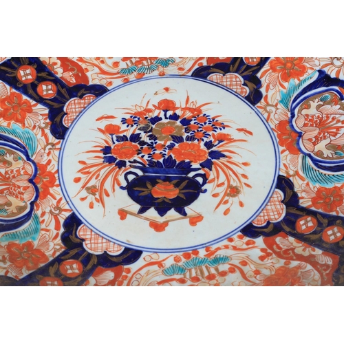 109 - A PAIR OF JAPANESE IMARI CHARGERS c.1880, the circular fluted borders painted in typical palette to ... 