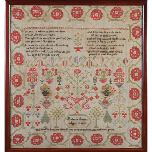 11 - AN EARLY 19TH CENTURY SAMPLER worked by Rebecca Cooper aged 11, 1832, with text, flowering trees and... 