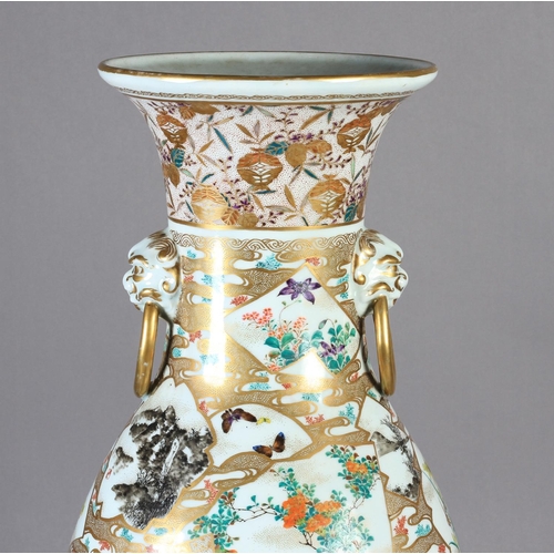 110 - A JAPANESE VASE c.1900 of baluster form painted with flowers, birds and pavilions in shaped panels, ... 