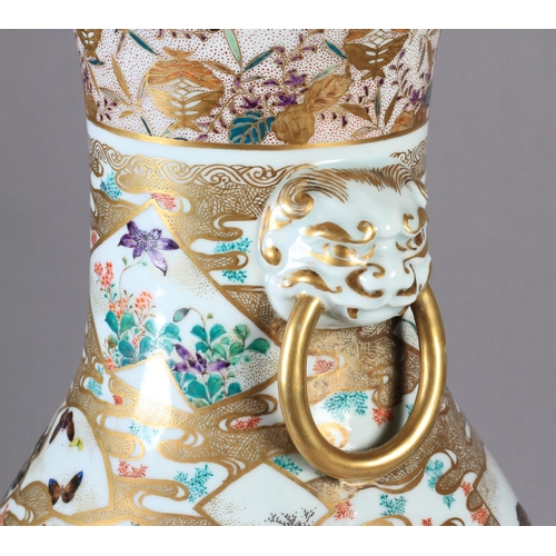 110 - A JAPANESE VASE c.1900 of baluster form painted with flowers, birds and pavilions in shaped panels, ... 