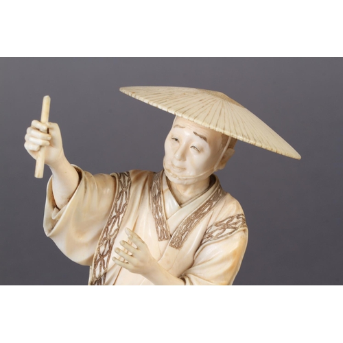 112 - A FINE JAPANESE IVORY OKIMONO OF A FISHERMAN, standing on a rock, a fishing net pegged down in the s... 