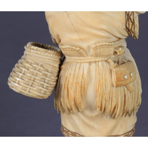 112 - A FINE JAPANESE IVORY OKIMONO OF A FISHERMAN, standing on a rock, a fishing net pegged down in the s... 