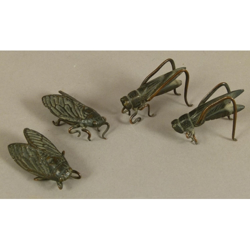 121 - FOUR JAPANESE BRONZE INSECTS, Meiji period including two crickets and two cicadas, 5cm wide and smal... 