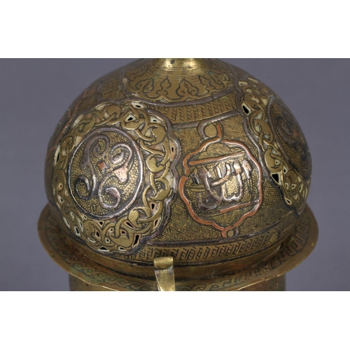 123 - A 19TH CENTURY EASTERN THREE COLOUR METAL CENSER with onion shaped cover pierced and applied filled ... 