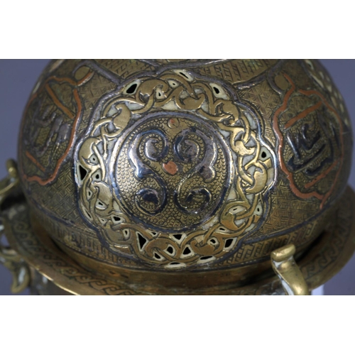 123 - A 19TH CENTURY EASTERN THREE COLOUR METAL CENSER with onion shaped cover pierced and applied filled ... 