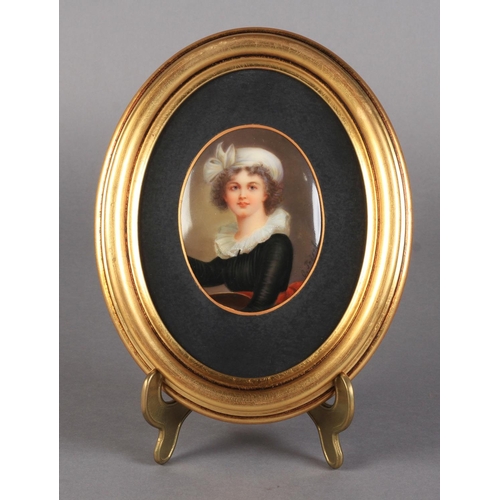 160 - A CONTINENTAL PORCELAIN OVAL PORTRAIT PLAQUE, head and shoulders, she wears a white turban, black dr... 