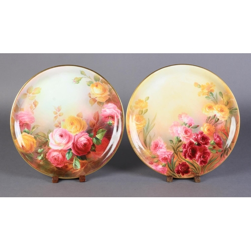 167 - A PAIR OF LARGE ROYAL DOULTON PLATES BY W M BIRKBECK, each painted with yellow and pink roses, one s... 