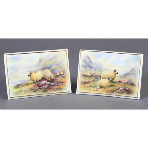 172 - A PAIR OF ROYAL WORCESTER RECTANGULAR PLAQUES painted with sheep in extensive misty moorland landsca... 