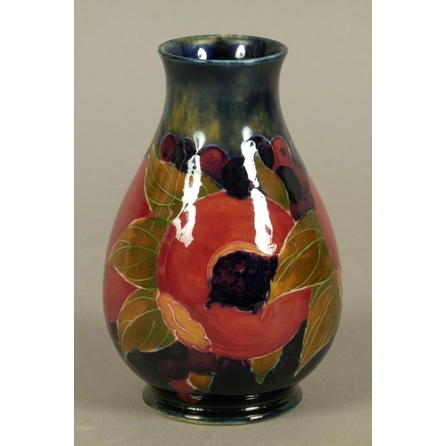 184 - A WILLIAM MOORCROFT POMEGRANATE DESIGN VASE c.1916 of baluster form, tubelined and glazed in ochre o... 