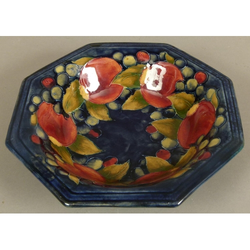 187 - A WALTER MOORCROFT POMEGRANATE DESIGN OCTAGONAL BOWL c.1945-49 tubelined and glazed in dark red and ... 