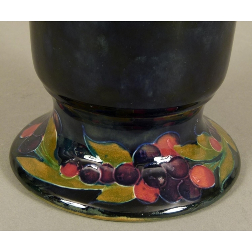 190 - A WILLIAM MOORCROFT POMEGRANATE DESIGN VASE c.1916, tapered cylindrical form with flared rim and on ... 