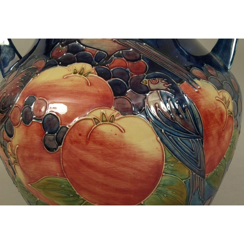 192 - A WALTER MOORCROFT FINCHES AND BERRIES DESIGN TWO HANDLED VASE c.1988 tubelined and glazed in pink a... 