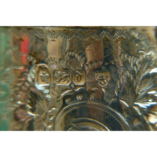 201 - A LATE VICTORIAN SILVER MOUNTED CRYSTAL CLARET JUG of oval flattened form, the semi-domed cover with... 