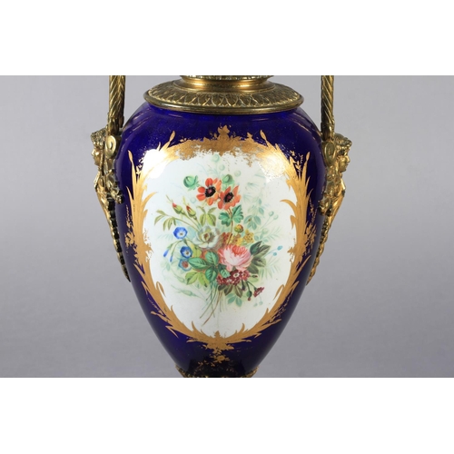 23 - A LATE 19TH CENTURY ORMOLU MOUNTED PORCELAIN VASE, the urn shaped body painted to the front with a y... 