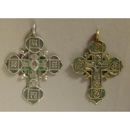 248 - AN ENGRAVED SILVER COLOURED METAL RUSSIAN CRUCIFIX, the front cast and with remnants of green enamel... 