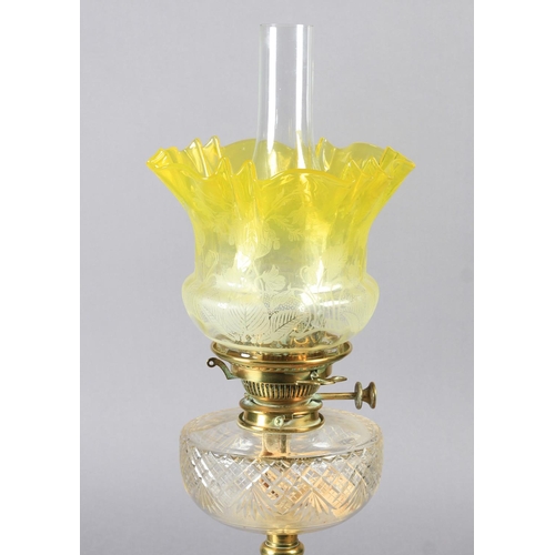 25 - AN EDWARD VII BRASS COLUMN OIL LAMP with stepped square base, cut glass reservoir with No 2 Hinks pa... 