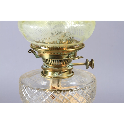 25 - AN EDWARD VII BRASS COLUMN OIL LAMP with stepped square base, cut glass reservoir with No 2 Hinks pa... 