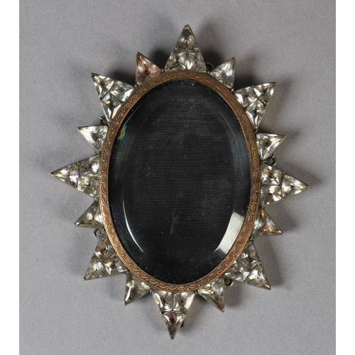 253 - A LATE 18TH/EARLY 19TH CENTURY WHITE METAL FRAME of oval 'starburst' form the border set geometric c... 