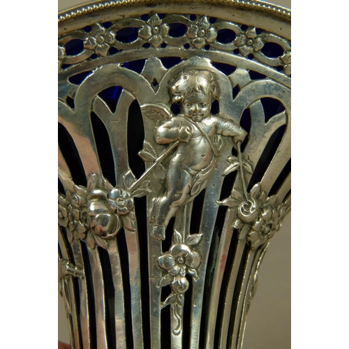 259 - A CONTINENTAL 800 STD SILVER SWING HANDLED BASKET of waisted form, pierced and embossed with cherubs... 