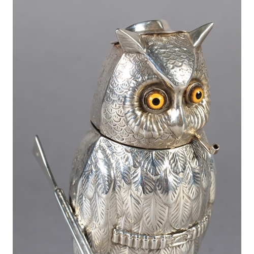 261 - AN INTERESTING CONTINENTAL SILVER COLOURED METAL VESTA modelled as a standing owl wearing a small ha... 