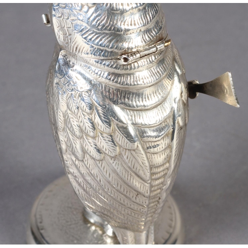 261 - AN INTERESTING CONTINENTAL SILVER COLOURED METAL VESTA modelled as a standing owl wearing a small ha... 