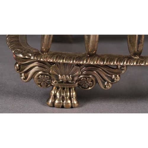 271 - A GEORGE IV SILVER SEVEN BAR TOAST RACK, by William Eley, London 1930, of arched form with leaf capp... 