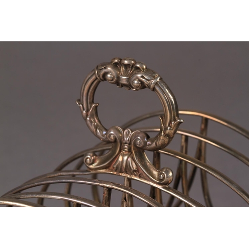 271 - A GEORGE IV SILVER SEVEN BAR TOAST RACK, by William Eley, London 1930, of arched form with leaf capp... 