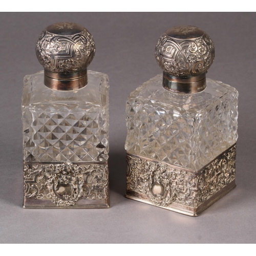 272 - A PAIR OF EDWARD VII SILVER MOUNTED AND DIAMOND CUT GLASS COLOGNE BOTTLES, Sheffield 1902 by James D... 