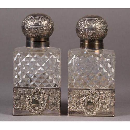 272 - A PAIR OF EDWARD VII SILVER MOUNTED AND DIAMOND CUT GLASS COLOGNE BOTTLES, Sheffield 1902 by James D... 