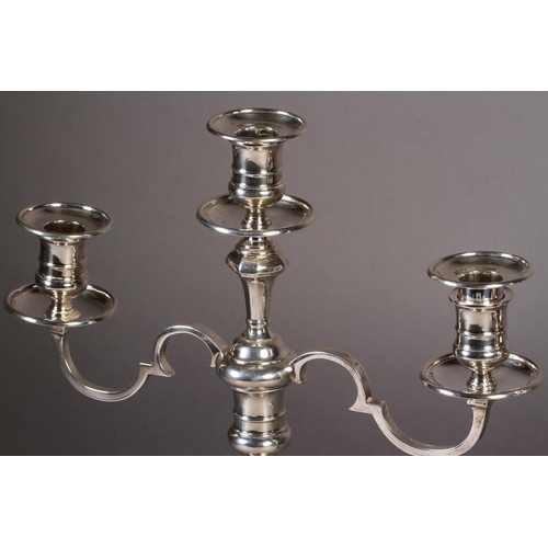 274 - A PAIR OF GEORGE II STYLE SILVER TWO BRANCH THREE LIGHT CANDELABRUM with knopped octagonal stems and... 