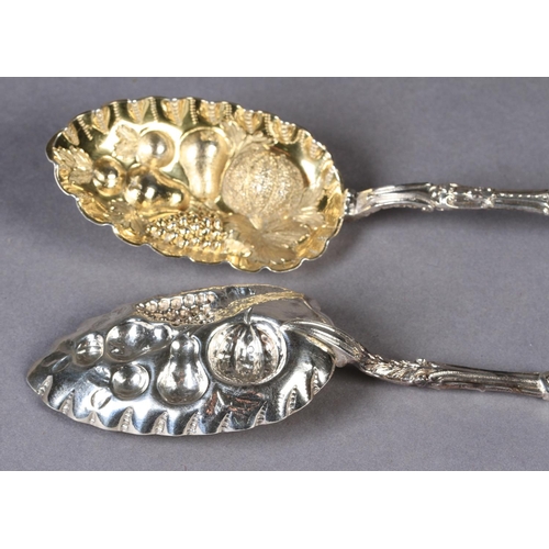 278 - A PAIR OF VICTORIAN SILVER 'BERRY' SPOONS, with fine cast lambrequin terminals, the neck and handles... 