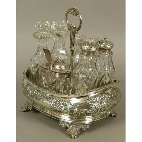 286 - AN EARLY VICTORIAN ROUNDED RECTANGULAR CRUET FRAME with post and ring handle, the body embossed over... 