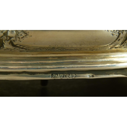 286 - AN EARLY VICTORIAN ROUNDED RECTANGULAR CRUET FRAME with post and ring handle, the body embossed over... 