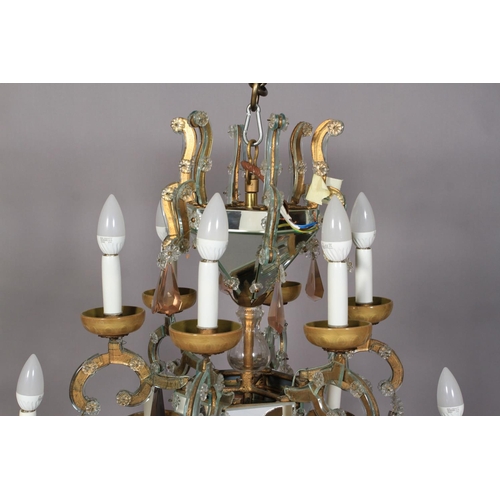 29 - A SPANISH THREE TIER SIX FLATTENED ARM CHANDELIER with three mirrored hexagonal pendants, the branch... 