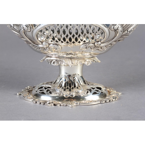 290 - A SILVER PEDESTAL BASKET, pierced cast and chased, the oval body with foliate clasped border and ova... 