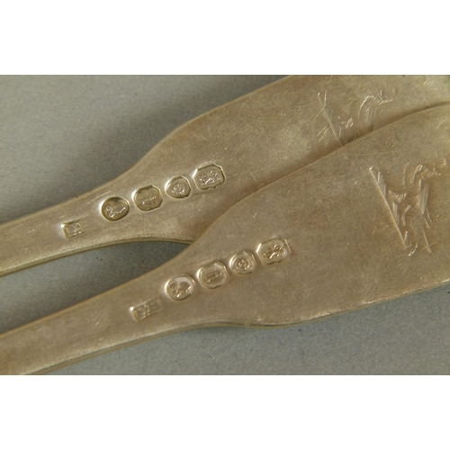 308 - A SET OF SIX GEORGE IV FIDDLE PATTERN TABLE FORKS engraved with a crest, by Francis Higgins, London ... 